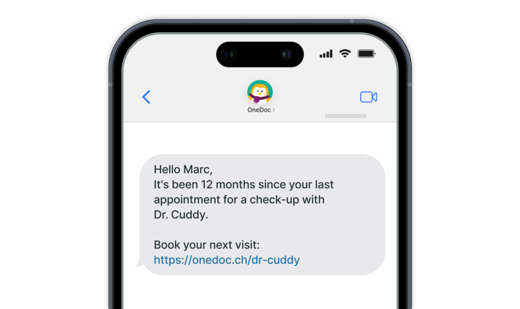 Phone displaying a text message inviting a patient to make a follow-up appointment.